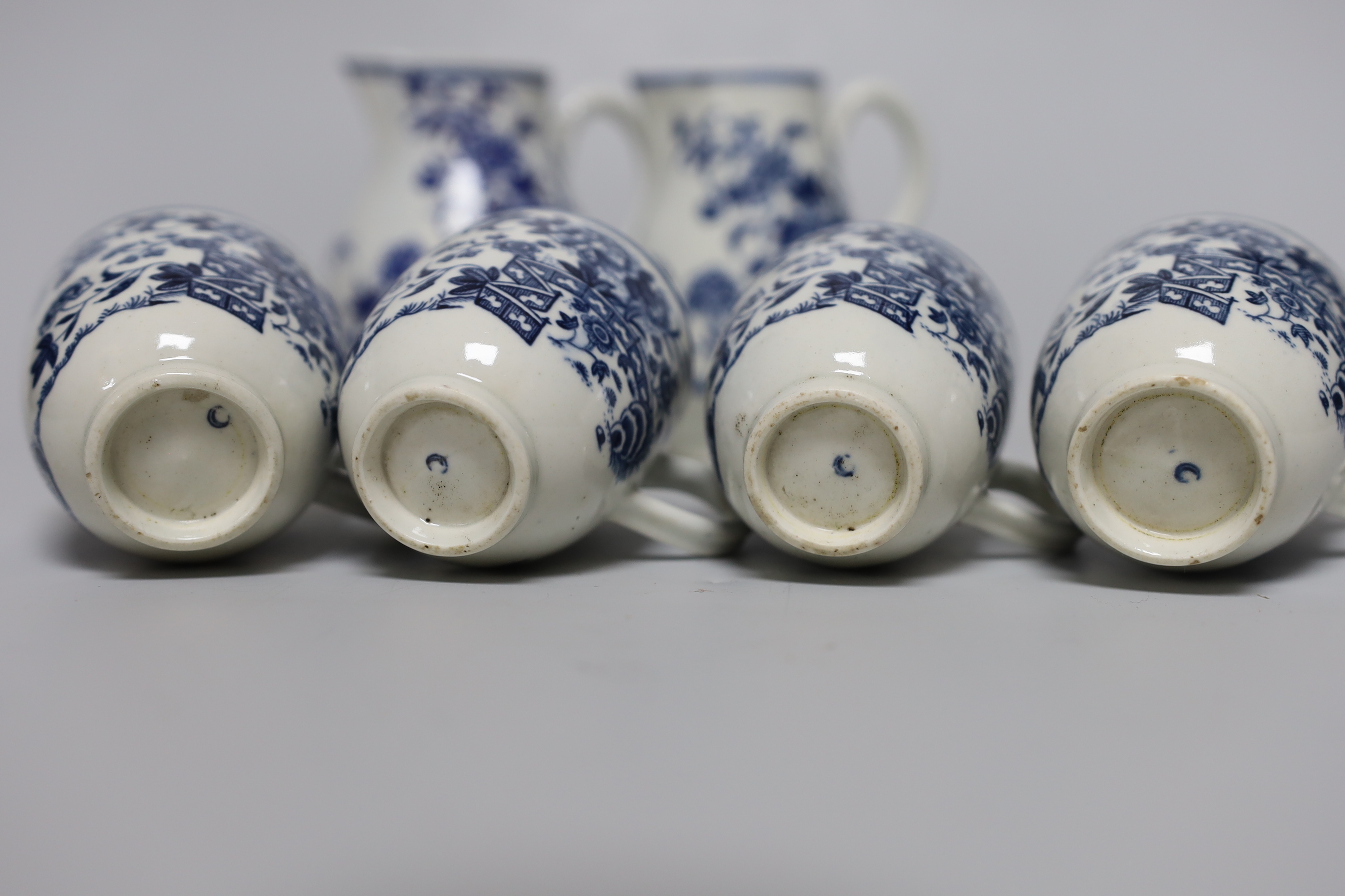 A Worcester sparrowbeak jug printed with the Fence pattern, another sparrowbeak similar and four Worcester coffee cups all printed with the Fence pattern